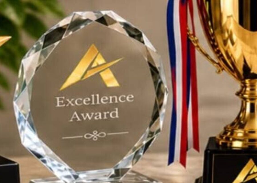 Crystal excellence award and gold cup trophy branded by AXIMO